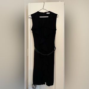 Calvin Klein black sleeveless ruffle front belted dress.